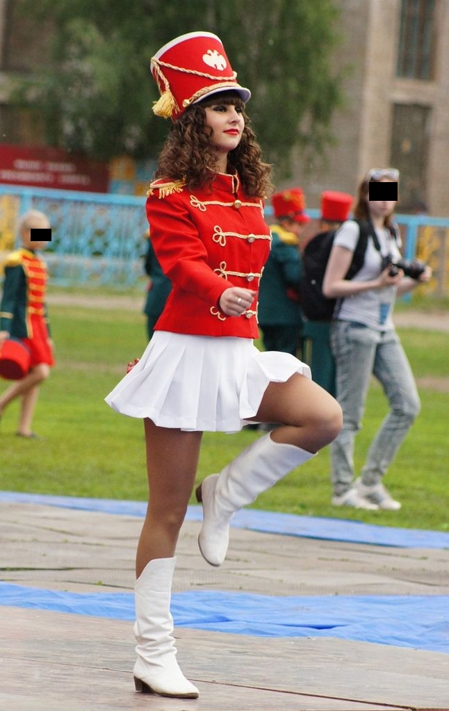 Auburn Majorette with Bare Legs wearing White Pleated Miniskirt and White Boots